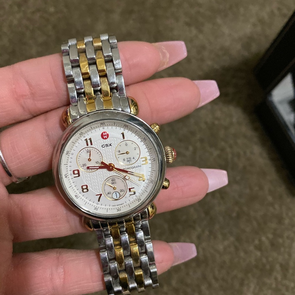 Michele csx comes with two tone bracelet